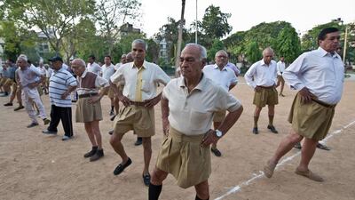 Indian senior swayamsevaks, or volunteers, from the Rashtriya Swayamsevak Sangh, excercise during the Shakha - a gathering of swayamsevaks - in New Delhi on May 18, 2014. Prakash Singh/AFP Photo
