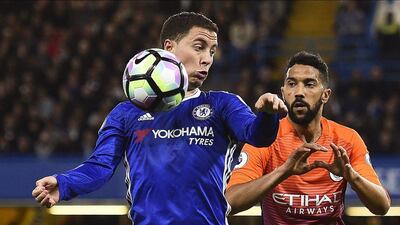 Chelsea's Eden Hazard vies for the ball against Manchester City's Gael Clichy. Will Oliver / EPA