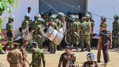 Sri Lankan personnel stand guard outside the Negombo prison after deadly clashes between inmates. AFP