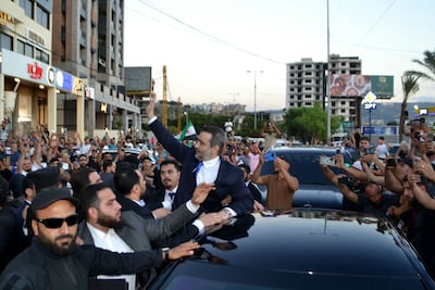 Syria's Foreign Minister Asaad Al Shibani waves to crowds on arrival in the northern Lebanese city of Tripoli. AFP