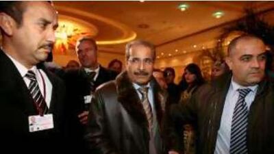 Mohammed bin Dhaen al Hamli, the Minister of Energy, is surrounded by security guards on his arrival in Oran, Algeria, for the Opec meeting.