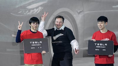 Elon Musk at Tesla's Shanghai factory. In recent weeks, Mr Musk has praised Tesla employees in China for 'burning the 3am oil' while criticising Americans who he described as 'trying to avoid going to work at all'. AP