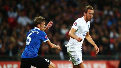 Harry Kane of England holds off Aleksandr Dmitrijev of Estonia during their Euro 2016 qualifying match on Friday night. Clive Rose / Getty Images