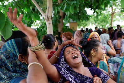 Relatives mourn the victims of the Air India plane crash in Ahmedabad, western India. Reuters