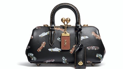 Vintage cars breathe life into this black edition of the Kisslock Satchel