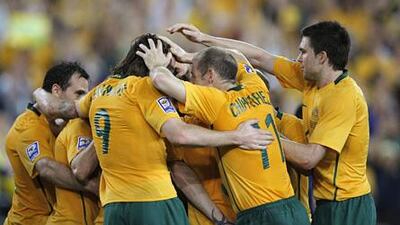 The Australia players celebrate after their 2-0 win over Uzbekistan in Syndey today.