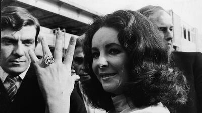 Elizabeth Taylor’s engagement ring from Richard Burton featured an enormous 33.19-carat centre stone with two tapered baguette diamonds on either side. After her death, it sold at a 2011 Christie’s auction, for Dh32 million. Express Newspapers / Hulton Archive / Getty Images