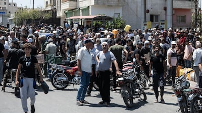 Large crowds of people from Sweida gather in front of a gas station to obtain their allocations of diesel and gasoline after the siege imposed on by the Syrian government.