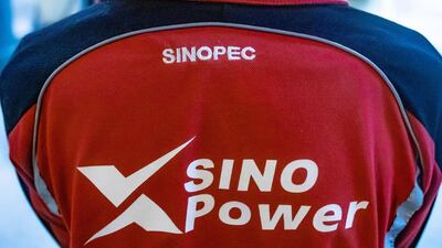 A Sinopec employee at a company fuel station in Hong Kong. The fim has been hit by Unipec loss. Bloomberg