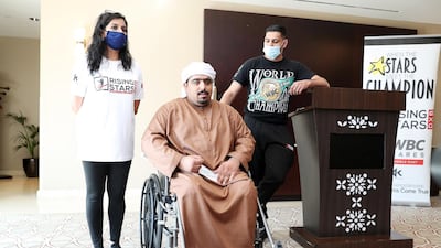 Former two-time world boxing champion Amir Khan poses for a photograph with Nasser Hamza. Pawan Singh / The National