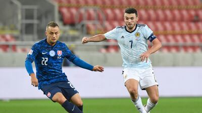 Scotland’s John McGinn takes on Slovakia’s Stanislav Lobotka. Reuters