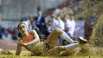 Ekaterina Koneva of Russia jumps during the triple jump competition at the Russian Winter IAAF Indoor Athletic Championship in Moscow on Sunday. Alexander Zemlianichenko / AP / February 14, 2016