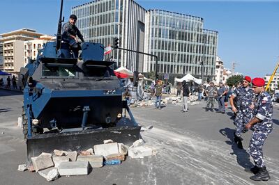 A policeman rides on a military vehicle in Beirut, Lebanon, October 30, 2019. Reuters
