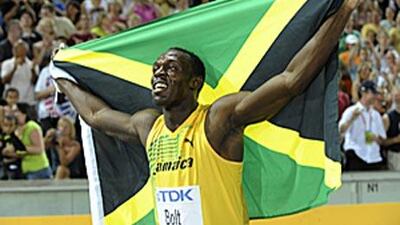 Jamaica's Usain Bolt celebrates after winning the men's 100m final in Berlin. Bolt set a new world record.
