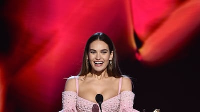 Lily James presents an award. AP Photo