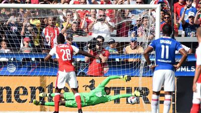Arsenal player Joel Campbell (L) scores a goal against MLS All-Stars goalie Andre Blake during the MLS All-Star match at Avaya Stadium in San Jose, California on July 28, 2016. Josh Edelson / AFP