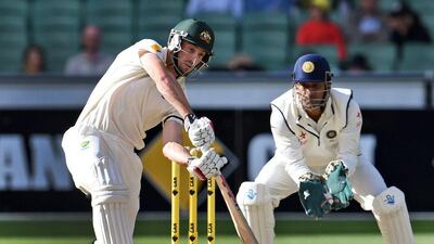 Australia batsman Shaun Marsh plays a shot during the fourth day of the third Test against India on Monday in Melbourne. William West / AFP / December 29, 2014