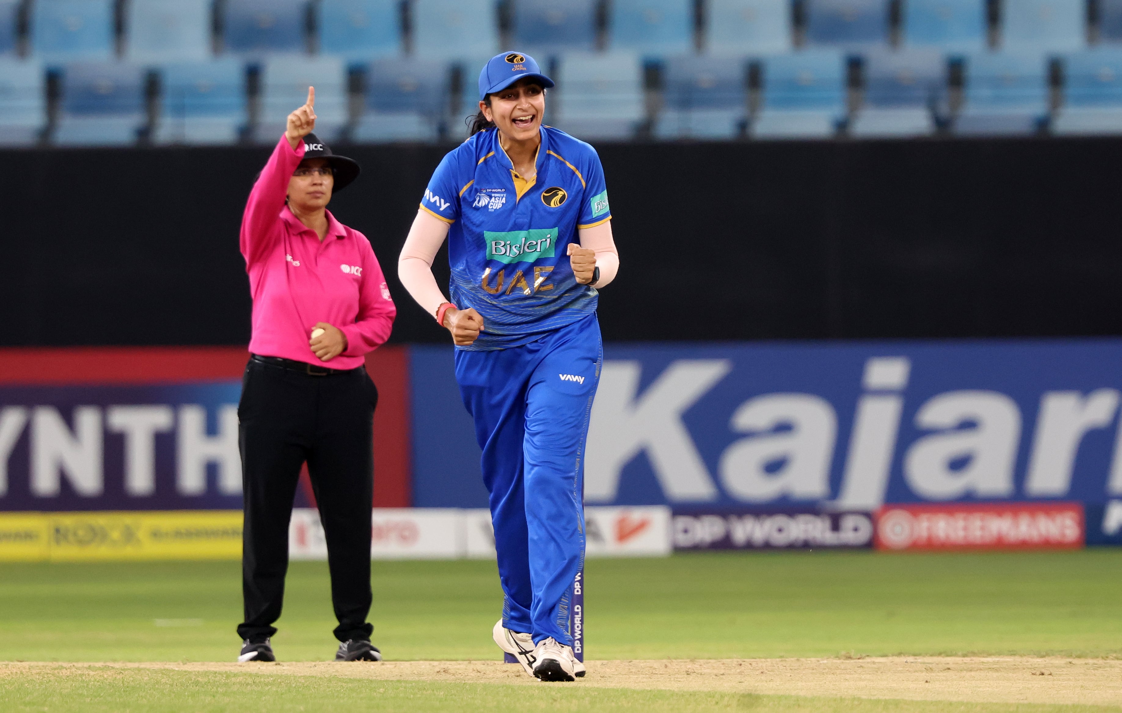UAE's Esha Oza celebrates the wicket of Indonesia's Rahmawati Pangestuti