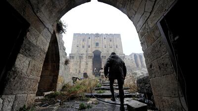 Forces loyal to Syria's president Bashar Al Assad walk inside Aleppo's historic citadel. Omar Sanadiki / Reuters