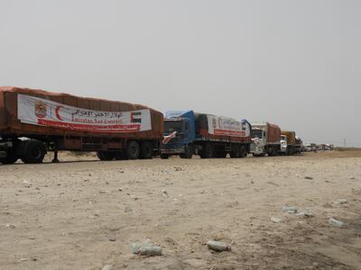 Dozens of trucks carrying aid supplies wait at the edge of Hodeidah to carry vital supplies to trapped civilian populations. Ali Mahmood Mohamed / The National