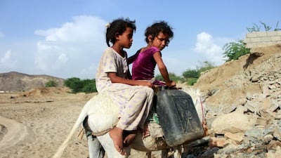 Children riding a donkey return home with jerrycans filled with water from a cistern, at a make-shift camp for displaced Yemenis in the northern Hajjah province on April 29, amid a severe shortage of water. Yemen has suffered years of war that have driven millions from their homes and plunged the country into the world's worst humanitarian crisis. Essa Ahmed/ AFP
