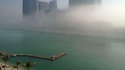 Buildings on Al Maryah Island wrapped in fog this morning. Brian Kerrigan / The National