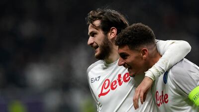 Napoli's Giovanni Di Lorenzo celebrates with Khvicha Kvaratskhelia after scoring his side's second goal in the 2-0 Champions League round of 16 win at Eintracht Frankfurt on February 21, 2023. AP