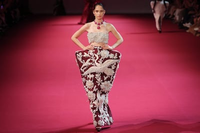 Intricate handwork, filled with symbols of beauty and protection, in Malhotra's first haute couture collection. AFP