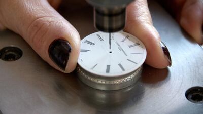 A watchmaker works on the dial of a timepiece. Courtesy Atelier Laurent Ferrier
