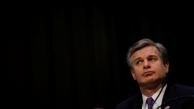 FBI Director Christopher Wray waits to testify during a Senate Intelligence Committee hearing on 'Worldwide Threats' on Capitol Hill on February 13, 2018. President Donald Trump suggested on Saturday that the FBI had neglected warning signs about the February 14 Florida shooting. Leah Millis / Reuters