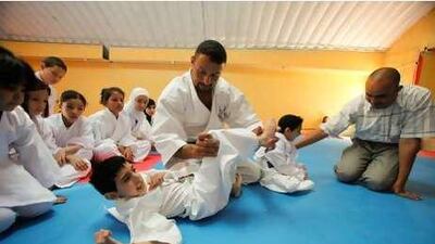 Hosam Ayyad, head of the Japan Karate Association in Jordan, trains children suffering from physical and mental illness.