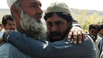 Relatives mourn during the funeral of a quake victim the mountainous district of Harnai in south-west Pakistan. AFP
