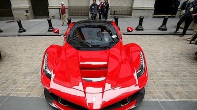 A Ferrari car is parked at the entrance of the New York Stock Exchange in 2014. Eduardo Munoz / Reuters