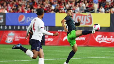 Luiz Phellype of Sporting, right, in action against Virgil van Dijk of Liverpool. AFP