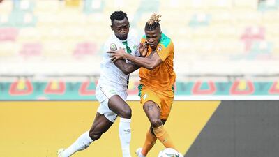 Sierra Leone's Mustapha Bundu (fights for the ball with Wilfred Zaha of the Ivory Coast. AFP