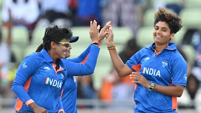 India's Meghna Singh, right, celebrates taking the wicket of Pakistan's Iram Javed. AFP