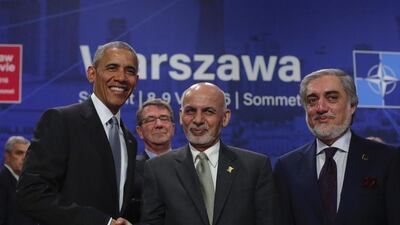 US president Barack Obama greets Afghan president Ashraf Ghani and chief executive Abdullah Abdullah, right, at the Nato summit in Warsaw, Poland, on July 9, 2016. Markus Schreiber / AP Photo
