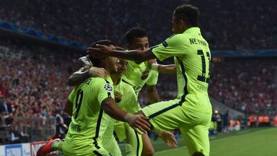 Barcelona's Neymar celebrates with teammates after scoring against Bayern Munich in the Champions League semi-final second leg on Tuesday. Patrik Stollarz / AFP / May 12, 2015
