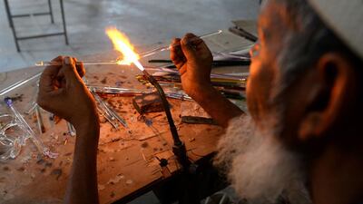 An Indian artisan attends a government-run training workshop to learn new techniques in glass art at Firozabad, after the government banned. instead -- and yet two decades on the Taj is still losing its lustre. / AFP / Sajjad Hussain / AFP