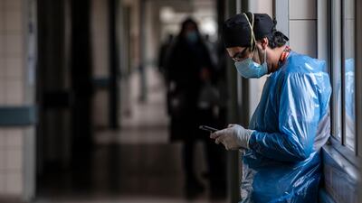 A nurse from the Critical Patients Unit takes a break at Barros Luco Hospital, in Santiago, Chile. AFP