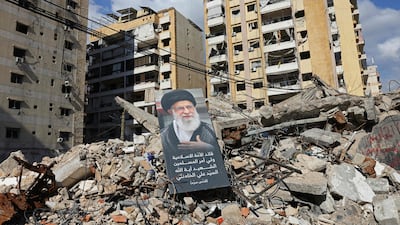 A banner with a picture of late Iranian supreme leader Ayatollah Ali Khamenei placed amid the rubble of a destroyed building in Beirut's southern suburbs earlier this month. AFP