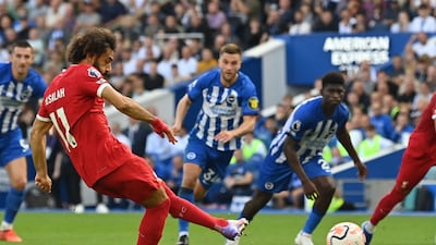 Liverpool's Mohamed Salah scores the second goal from the penalty spot against Brighton & Hove Albion. AFP