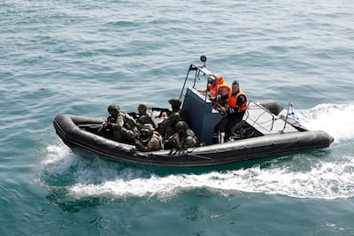 Iranian and Russian soldiers during a joint naval exercise in Sea of Oman. EPA