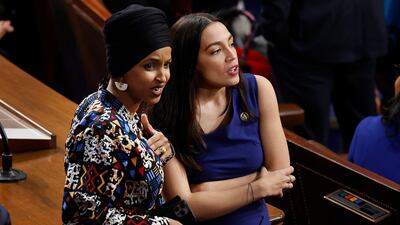Democratis Ilhan Omar and Alexandria Ocasio-Cortez speak in the House chamber after the legislative body fails to elect a speaker. AFP