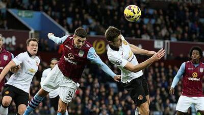 Aston Villa's Matthew Lowton, left. challenges Manchester United's Darren Fletcher during their English Premier League match in Birmingham, Britain, 20 December 2014. EPA/LINDSEY PARNABY