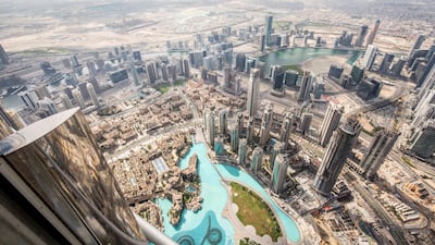 A view of Dubai Fountain, Downtown Dubai, Dubai Canal and Business Bay from the open deck from 152 floor of The Lounge. Photo: Leslie Pableo for The National