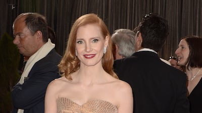 Jessica Chastain, in a rose gold strapless Armani Prive gown, arrives on the red carpet for the 85th Academy Awards in Hollywood, California on February 24, 2013. EPA