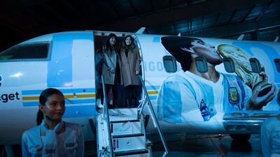 Diego Maradona's daughters, Dalma, right, and Yanina, pose for photographers during the presentation. AP