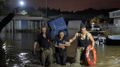 A man is rescued and evacuated during flooding of Kucukcekmece district in Istanbul on September 5, 2023. AFP
