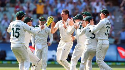 Australia pacer James Pattinson, centre, after dismissing New Zealand captain Kane Williamson. AFP